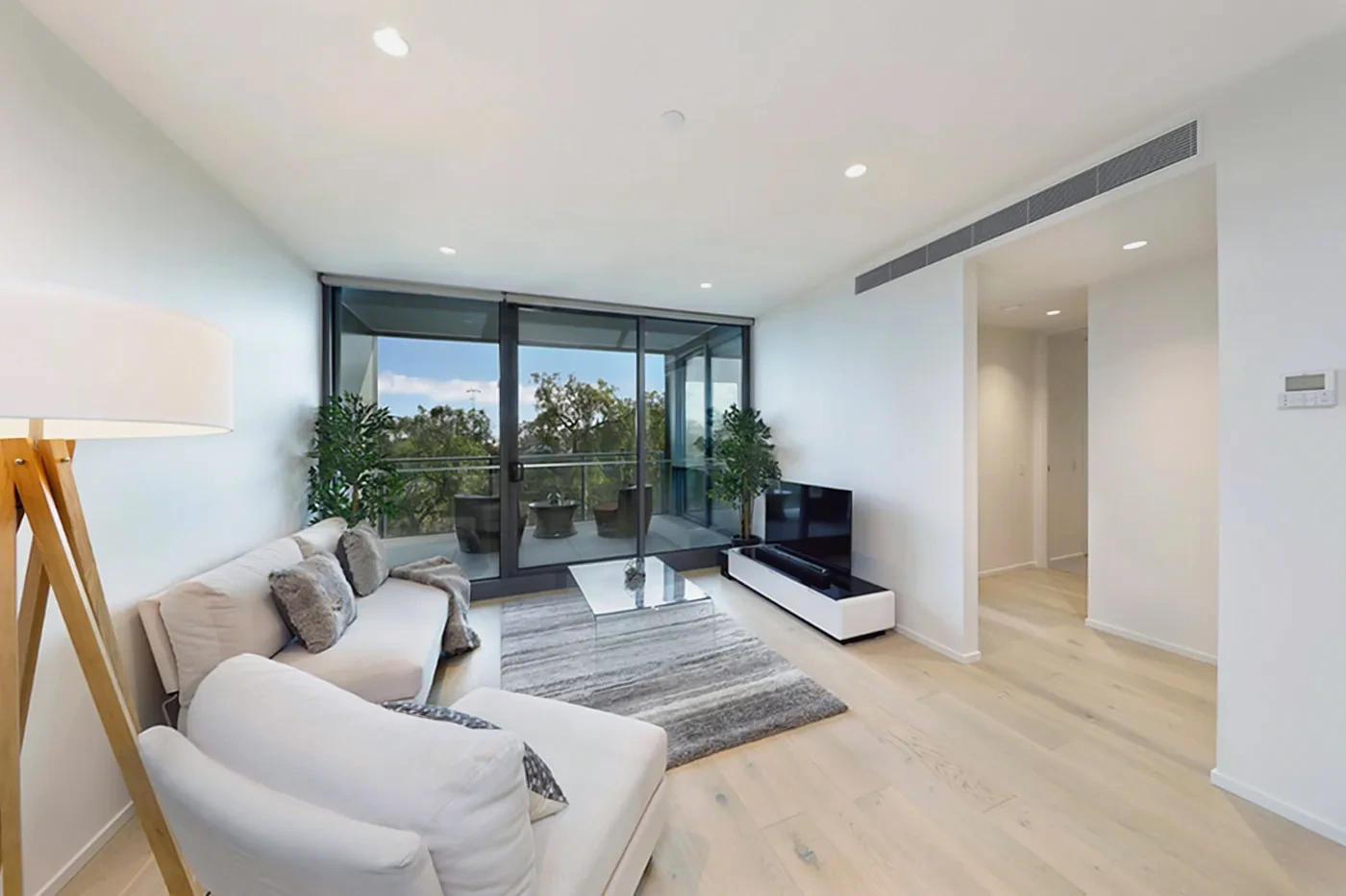 Exquisitely furnished living area opening to the balcony in Armadale