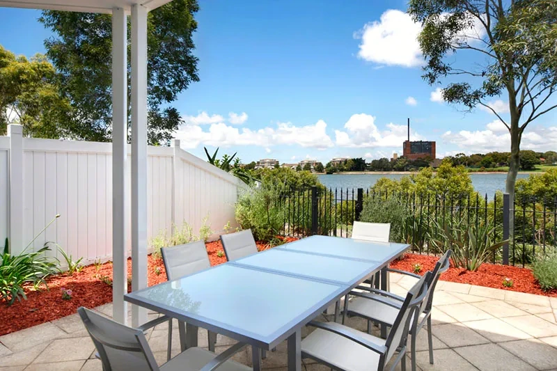Townhome terrace with water and golf-course surrounds