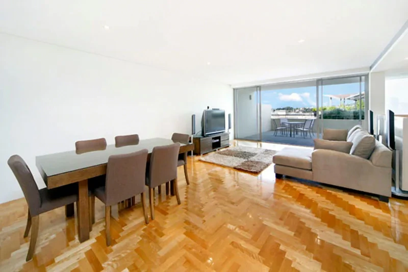 Open-plan living and dining opening to the terrace