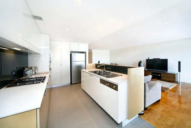 Contemporary kitchen with stone benchtops and gas cooktop