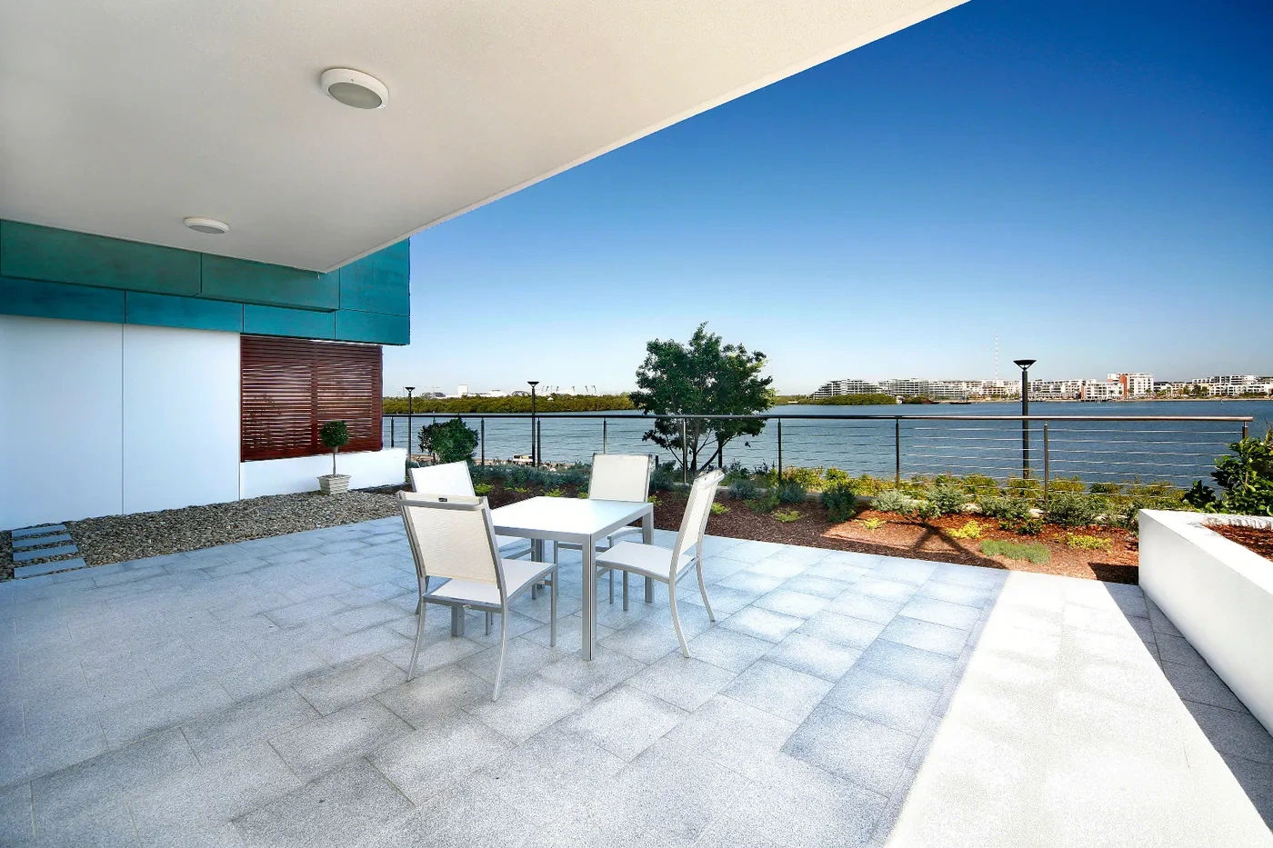 Waterfront terrace with river views at a Westprecinct serviced residence in Rhodes