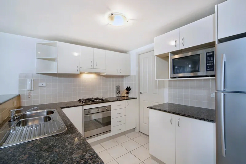 Gourmet stone-top kitchen with SMEG appliances and water views