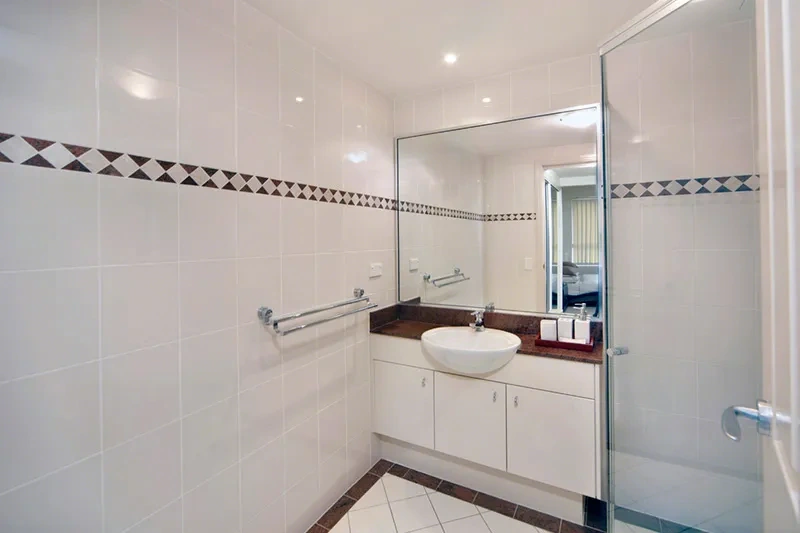 Modern floor-to-ceiling tiled ensuite bathroom