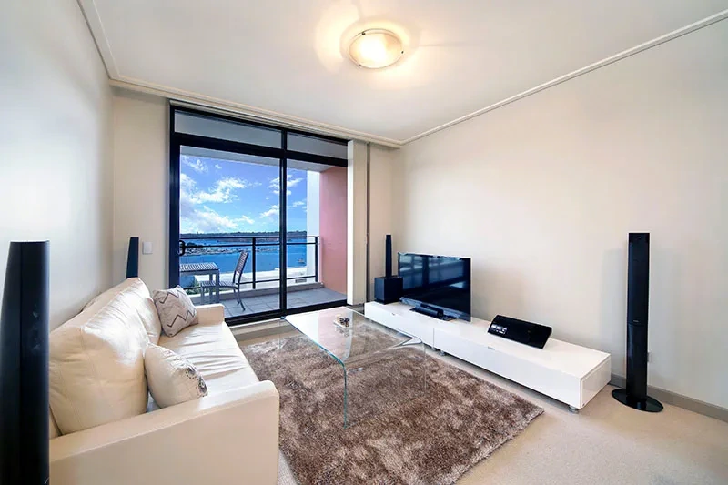 Bright north-facing furnished living area with water views