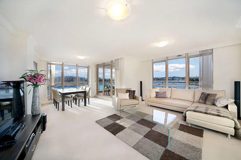 Expansive open-plan living area with waterfront views